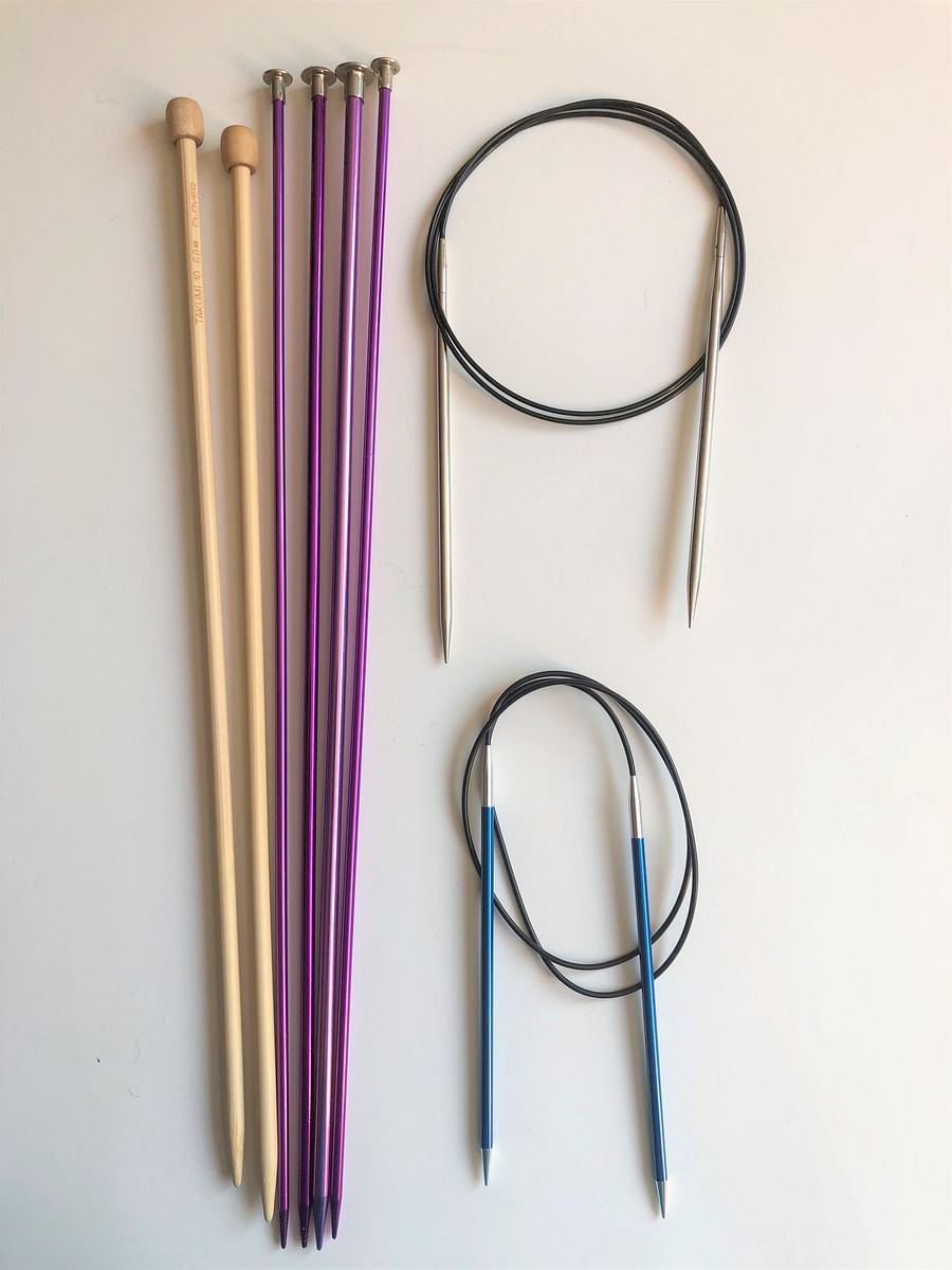 Variety of knitting needles including straight, circular, double-pointed, and interchangeable needles